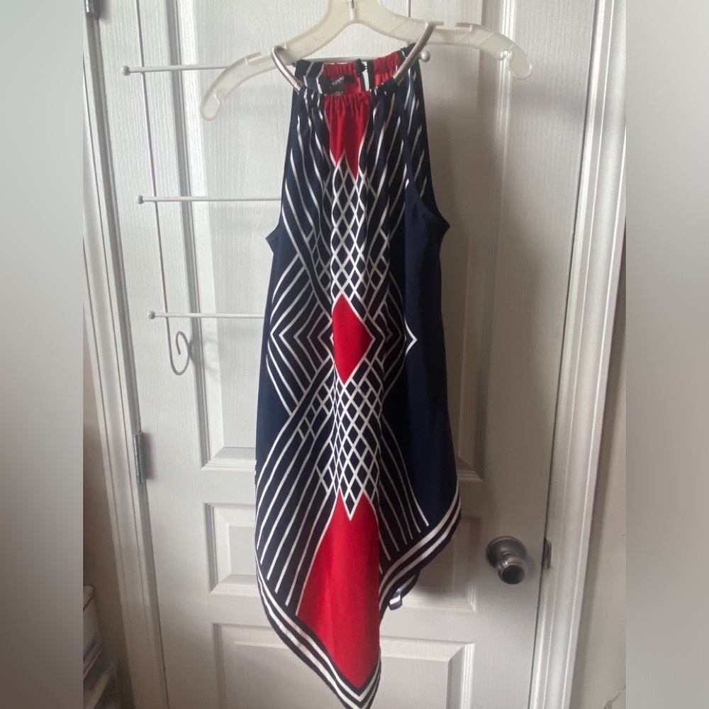 Alfani petites handkerchief top with silver metal on sides neckline.